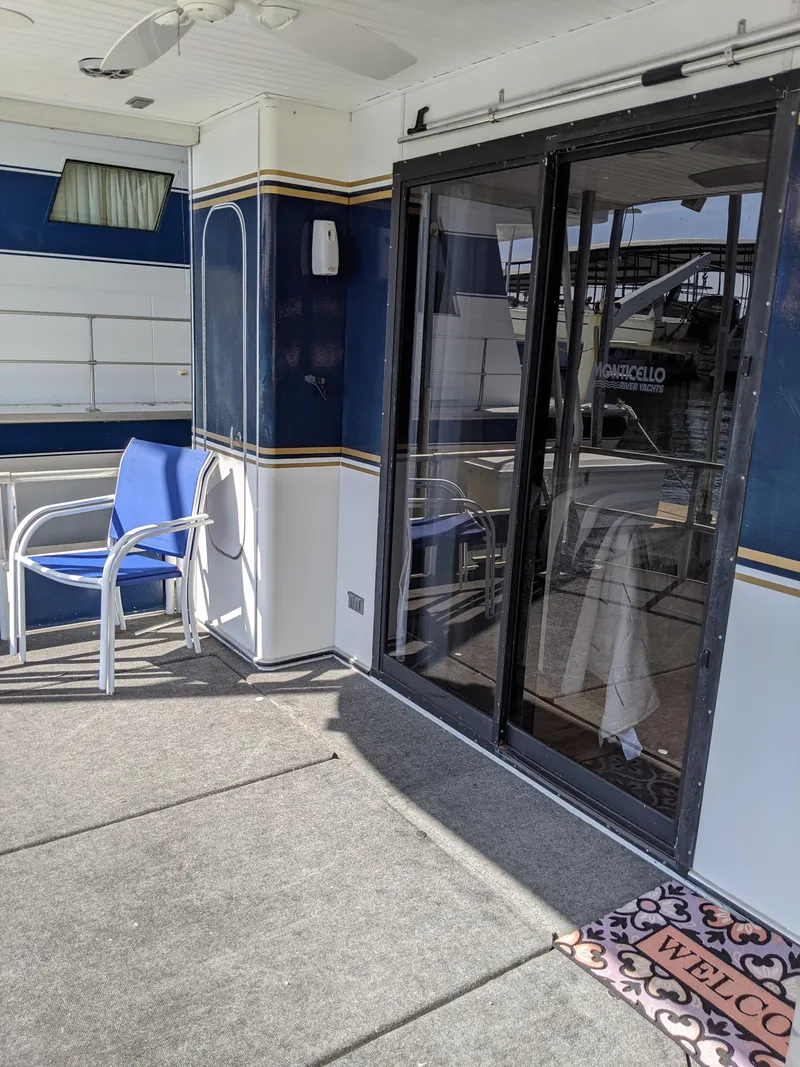 Slide: The Image of 2001 Monticello River Yacht deck with sliding glass doors and welcome mat. - 44