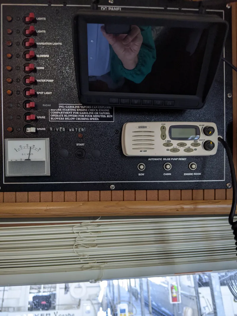 Slide: The Image of Control panel of a 2001 Monticello River Yacht with various switches and a display screen. - 46