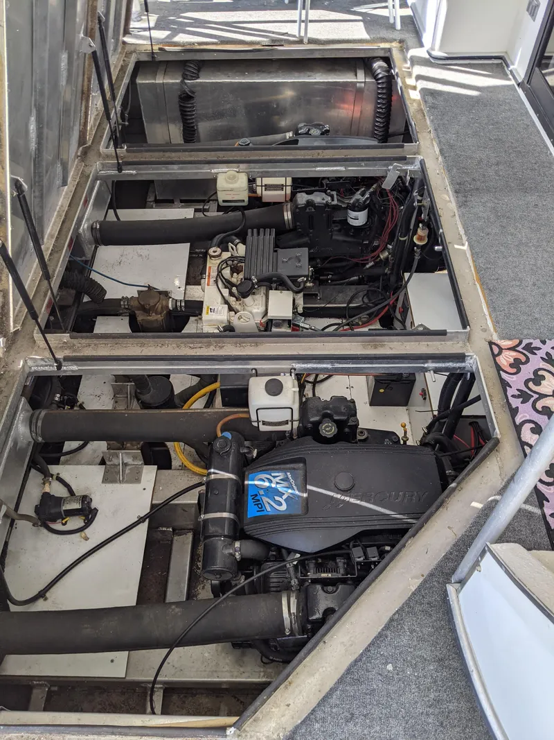 Slide: The Image of Engine compartment of a 2001 Monticello River Yacht showing mechanical components. - 56