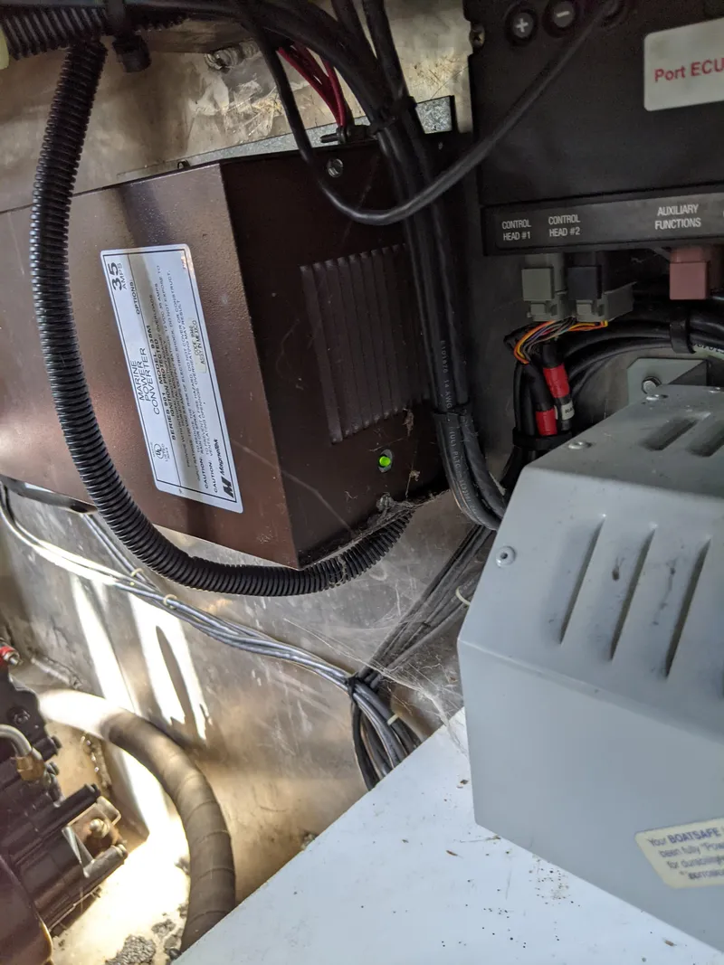 Slide: The Image of Engine compartment of a 2001 Monticello River Yacht showing electrical components and wiring. - 59