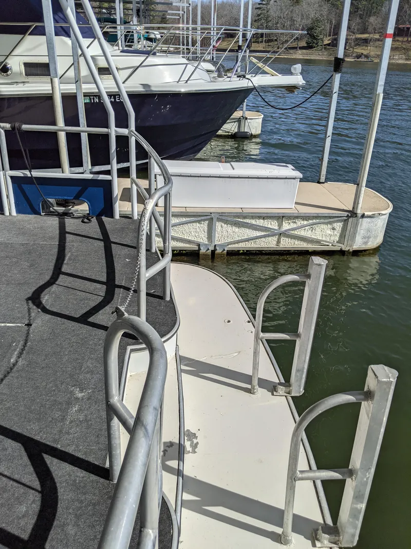 Slide: The Image of 2001 Monticello River Yacht docked at a marina. - 77