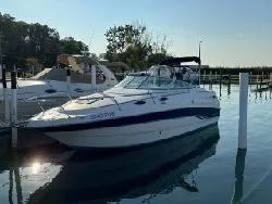 The Image of 2000 Chaparral 240 SIGNATURE boat docked in a marina. - 1