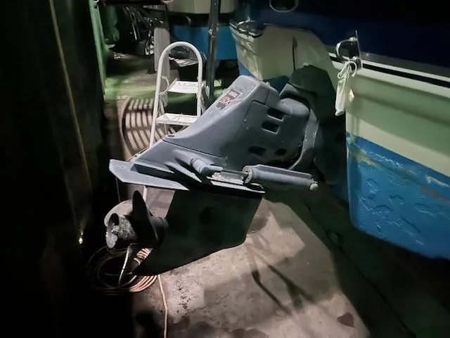 Slide: The Image of 2000 Chaparral 240 SIGNATURE boat engine and propeller in storage. - 15