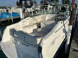 Slide: The Image of 2000 Chaparral 240 SIGNATURE boat docked at a marina. - 3