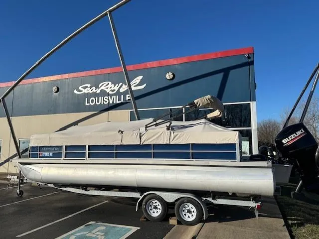 Slide: The Image of 2018 Lexington 325 pontoon boat on trailer at Sea Ray dealership in Louisville. - 3