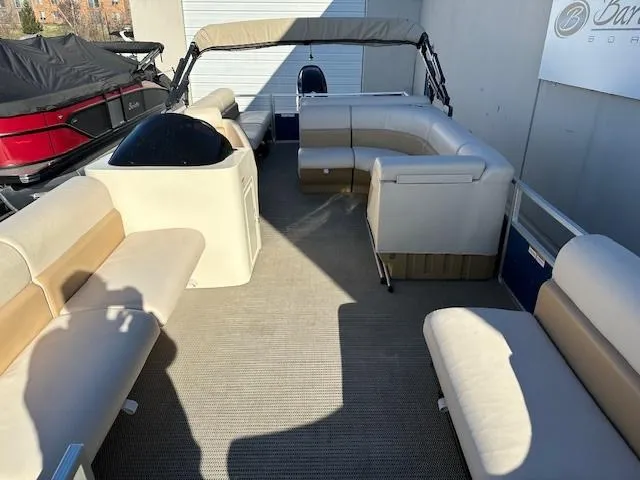 Slide: The Image of 2018 Lexington 325 pontoon boat with beige seating and canopy. - 4