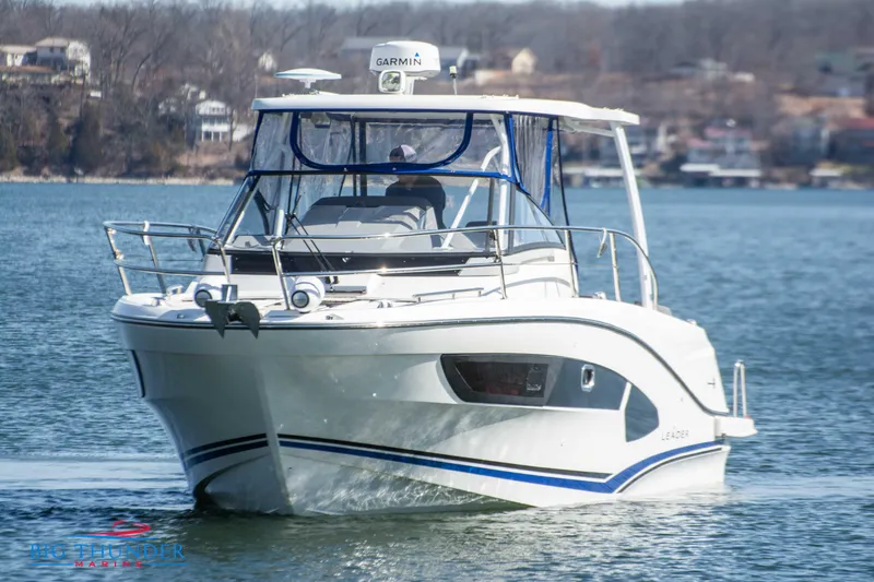 Slide: The Image of 2020 Jeanneau Leader 10.5 boat cruising on a lake. - 11