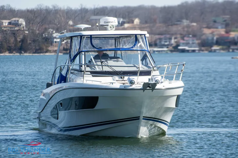 Slide: The Image of 2020 Jeanneau Leader 10.5 boat cruising on a calm lake. - 12