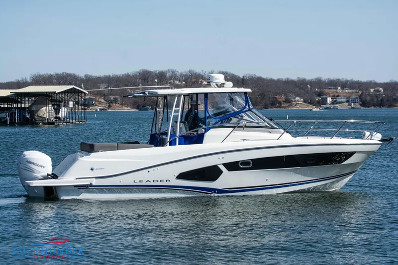 Slide: The Image of 2020 Jeanneau Leader 10.5 boat cruising on a lake. - 15