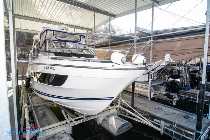 Slide: The Image of 2020 Jeanneau Leader 10.5 boat docked in a covered marina. - 20