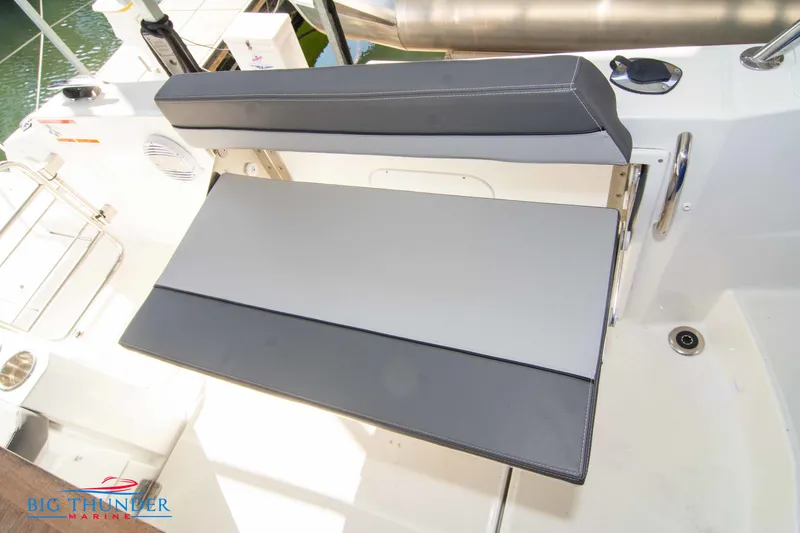 Slide: The Image of 2020 Jeanneau Leader 10.5 boat seating area with foldable bench. - 41