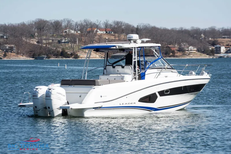 Slide: The Image of 2020 Jeanneau Leader 10.5 boat cruising on a lake. - 5