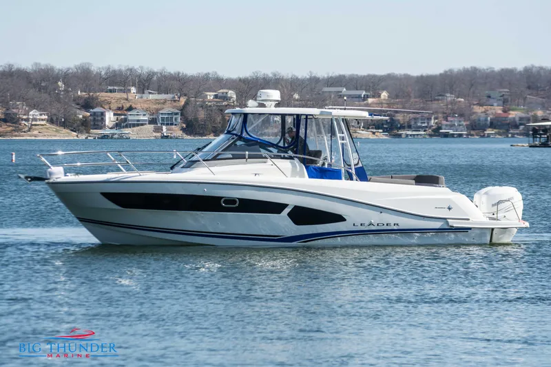 Slide: The Image of 2020 Jeanneau Leader 10.5 boat cruising on a lake. - 9