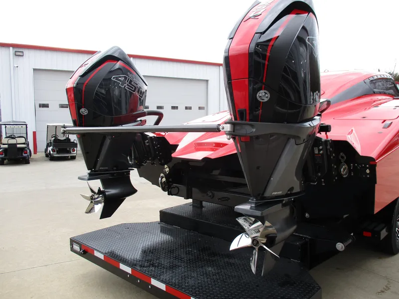 Slide: The Image of 2023 MTI 390XR boat with dual outboard engines on a trailer. - 10