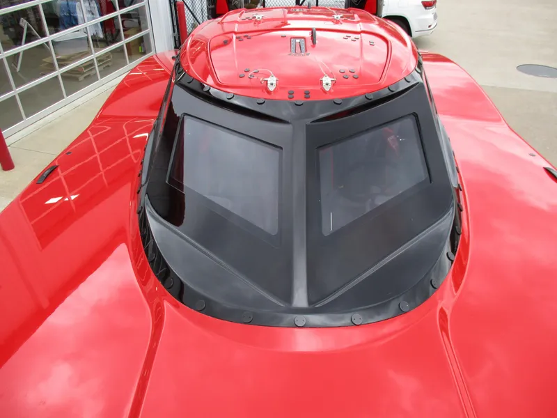 Slide: The Image of 2023 MTI 390XR red powerboat with sleek black windshield. - 15