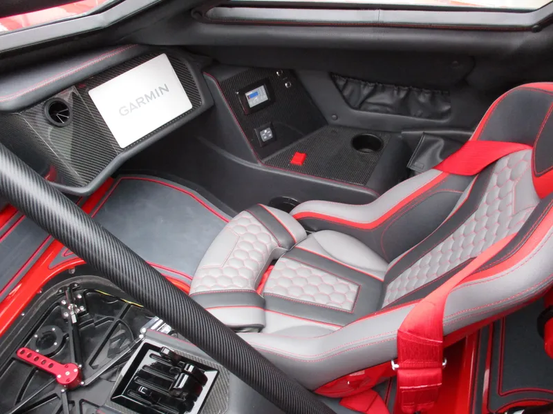 Slide: The Image of 2023 MTI 390XR interior with Garmin navigation system and red-gray racing seats. - 17