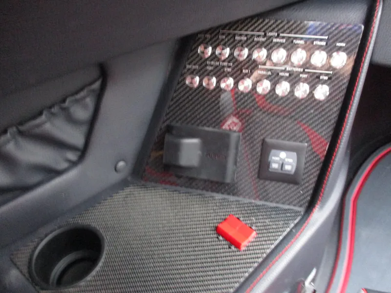 Slide: The Image of Control panel of 2023 MTI 390XR boat with carbon fiber finish. - 18