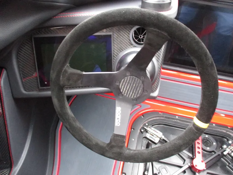 Slide: The Image of 2023 MTI 390XR steering wheel and dashboard close-up. - 19