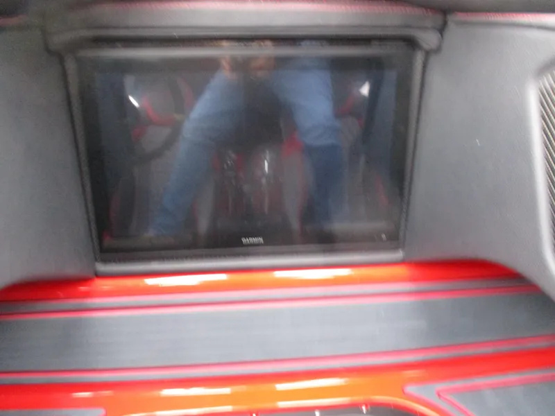 Slide: The Image of 2023 MTI 390XR interior with a built-in screen and red accents. - 20