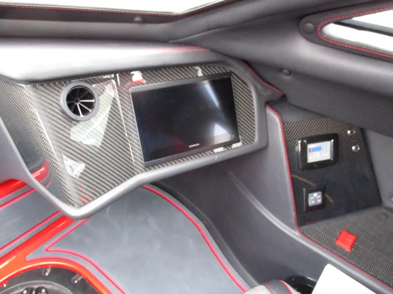 Slide: The Image of 2023 MTI 390XR interior dashboard with carbon fiber finish and touchscreen display. - 21