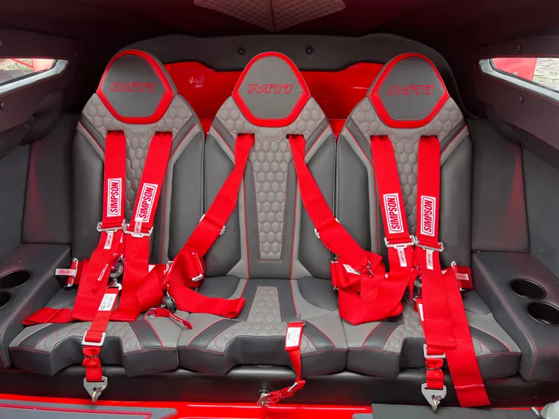 Slide: The Image of 2023 MTI 390XR interior with red racing seats and harnesses. - 25