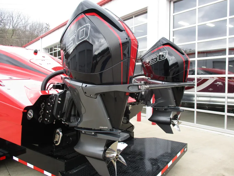 Slide: The Image of 2023 MTI 390XR boat with dual outboard engines on a trailer. - 6