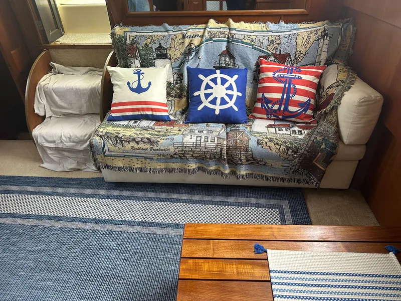 Slide: The Image of Nautical-themed interior of a 1987 Viking Boats 44 Motor Yacht with decorative pillows. - 11