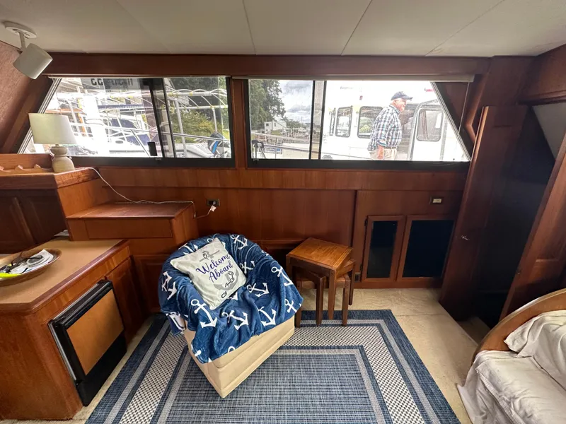 Slide: The Image of Interior of 1987 Viking Boats 44 Motor Yacht with cozy seating and nautical decor. - 14