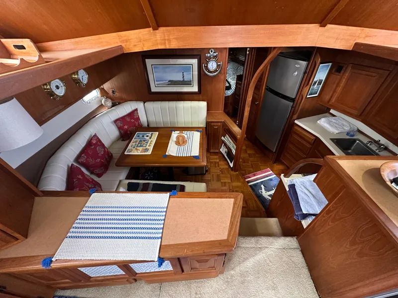 Slide: The Image of Interior of 1987 Viking Boats 44 Motor Yacht with dining area and kitchen. - 15