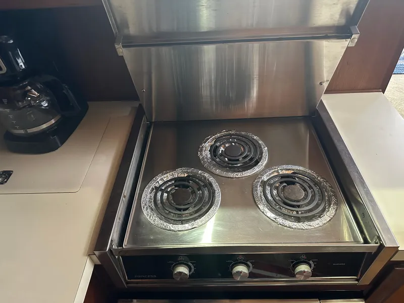 Slide: The Image of Stainless steel stove in the kitchen of a 1987 Viking Boats 44 Motor Yacht. - 18