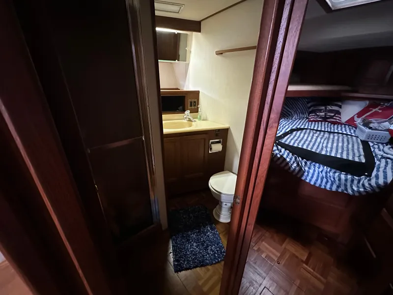 Slide: The Image of 1987 Viking Boats 44 Motor Yacht interior with bathroom and bedroom. - 26