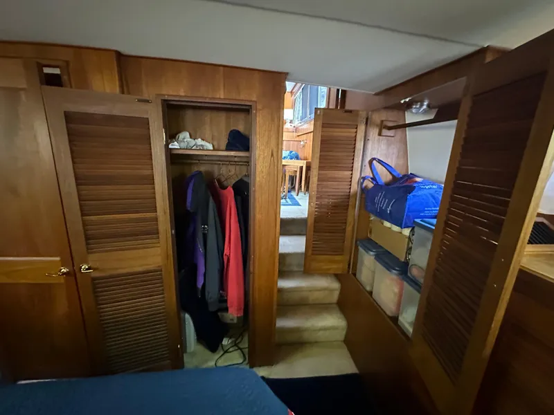 Slide: The Image of Interior of 1987 Viking Boats 44 Motor Yacht with wooden closets and storage. - 31