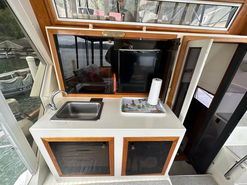 Slide: The Image of 1987 Viking Boats 44 Motor Yacht kitchen area with sink and storage cabinets. - 40