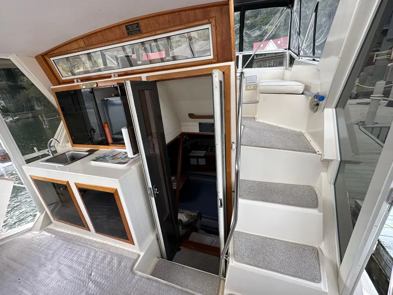 Slide: The Image of 1987 Viking Boats 44 Motor Yacht interior with stairs and kitchenette. - 41