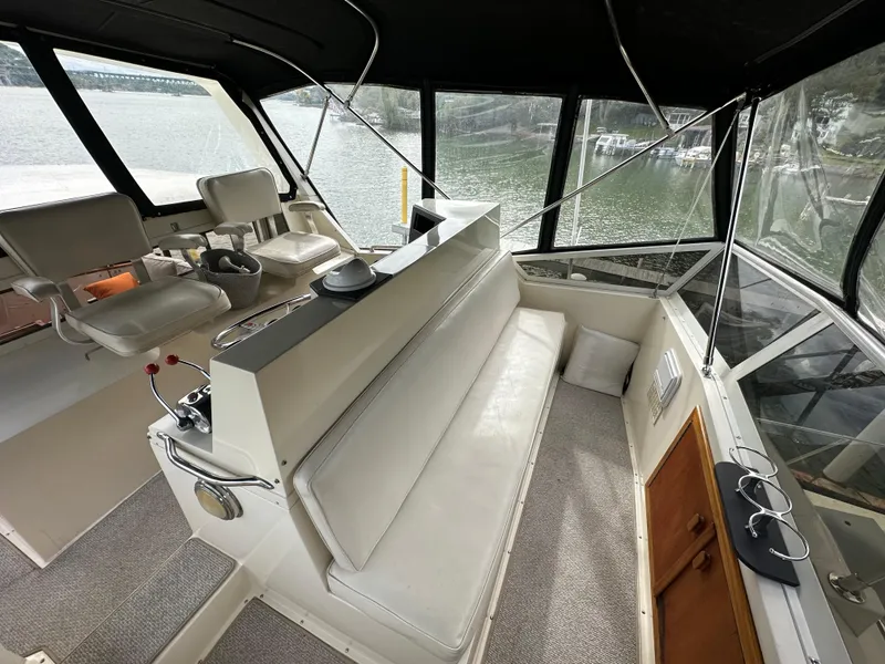Slide: The Image of 1987 Viking Boats 44 Motor Yacht interior with helm and seating area. - 47