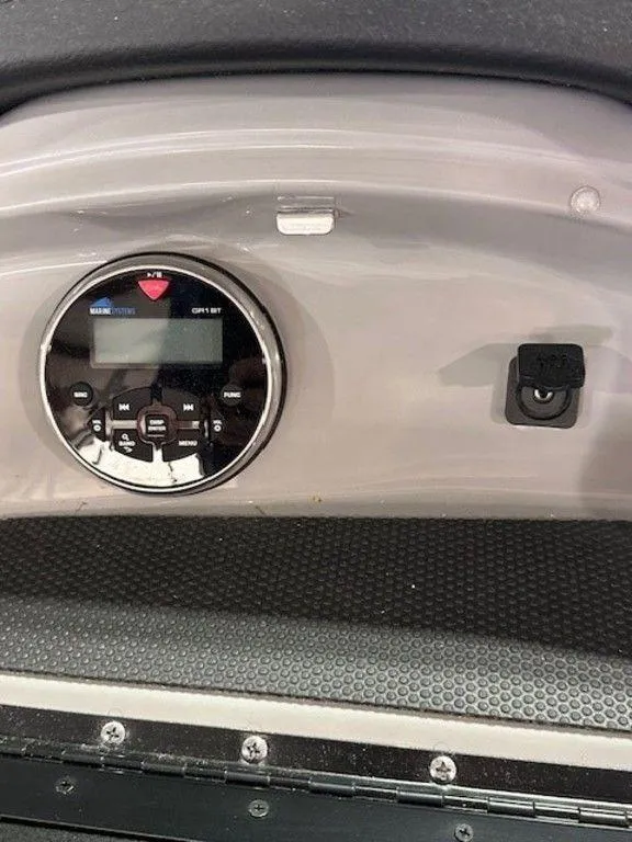 Slide: The Image of Dashboard of a 2021 Chaparral 19 SSi boat with control panel. - 13