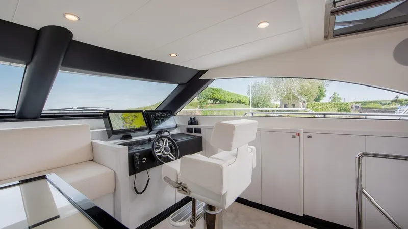Slide: The Image of Modern helm station of 2025 Van der Valk BeachClub 600 yacht with sleek design. - 7