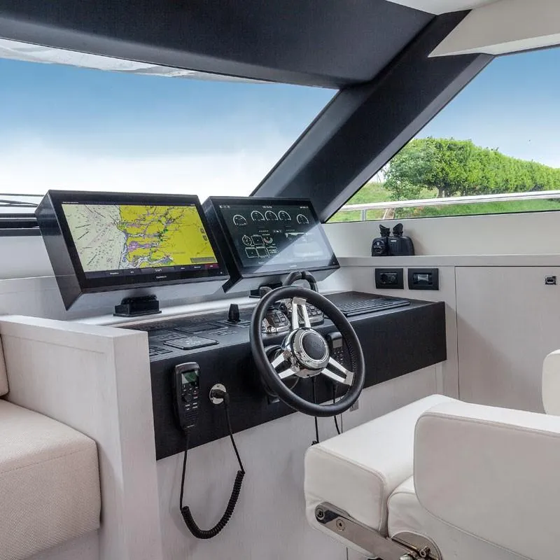 Slide: The Image of Helm station of 2025 Van der Valk BeachClub 600 yacht with navigation screens. - 8