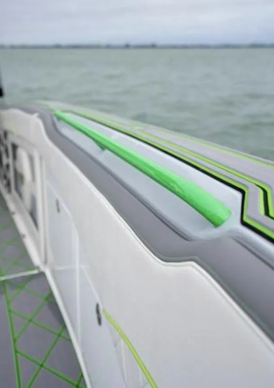 Slide: The Image of 2024 Deep Impact 399 Sport boat, modern design, green accents. - 12