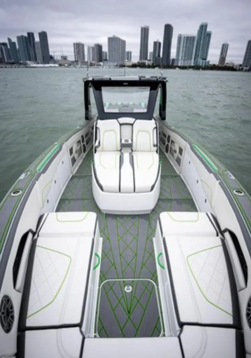 Slide: The Image of 2024 Deep Impact 399 Sport boat with city skyline backdrop. - 13