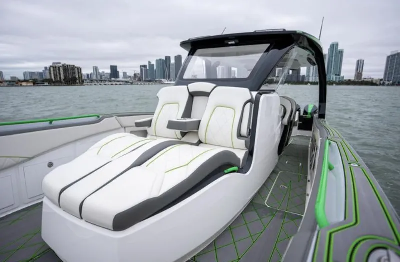 Slide: The Image of Luxurious 2024 Deep Impact 399 Sport boat on water with city skyline. - 16