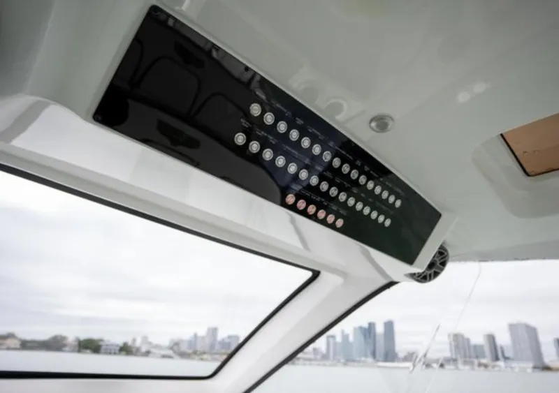 Slide: The Image of Interior view of 2024 Deep Impact 399 Sport boat with control panel. - 22
