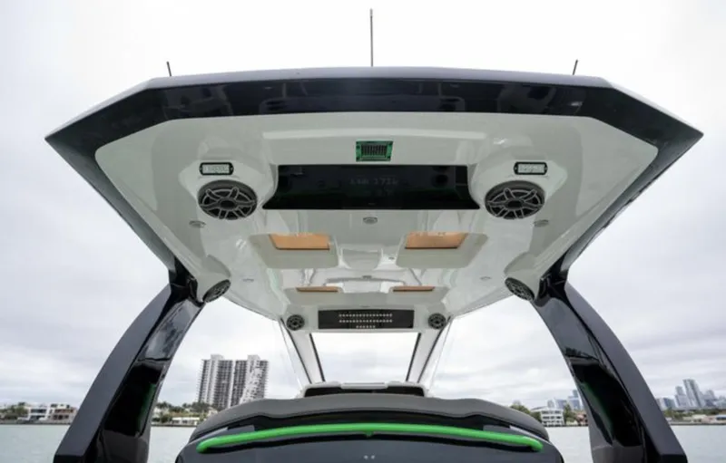 Slide: The Image of 2024 Deep Impact 399 Sport boat roof with speakers. - 26