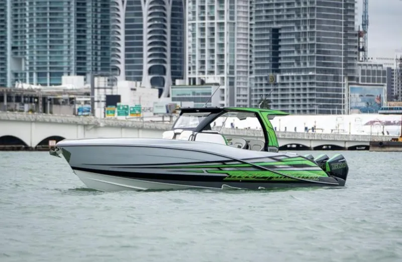 Slide: The Image of 2024 Deep Impact 399 Sport boat against urban skyline. - 3