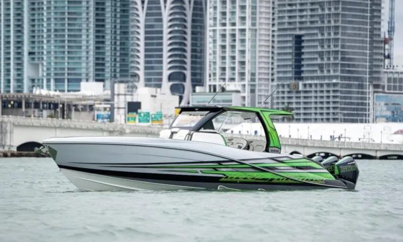Slide: The Image of 2024 Deep Impact 399 Sport boat against urban skyline. - 4