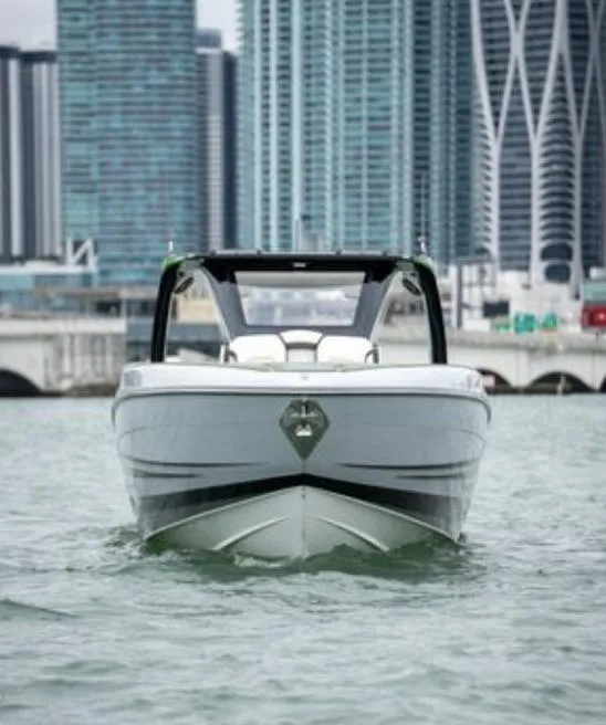 Slide: The Image of 2024 Deep Impact 399 Sport boat in front of city skyline. - 5
