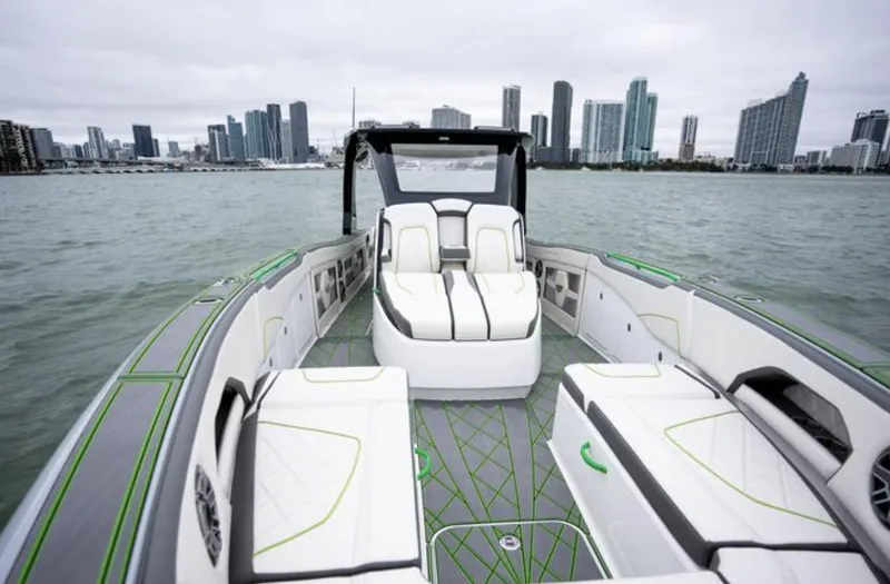 Slide: The Image of 2024 Deep Impact 399 Sport boat with city skyline in background. - 7