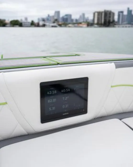 Slide: The Image of 2024 Deep Impact 399 Sport boat with digital display on water. - 8
