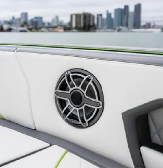 Slide: The Image of Speaker on Deep Impact 399 Sport boat, 2024 model, with city skyline background. - 9