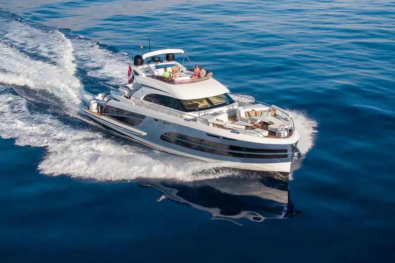 Slide: The Image of 2025 Van der Valk BeachClub 660 Flybridge yacht cruising on open water. - 4